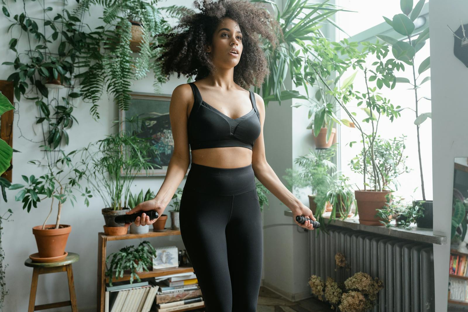 Woman in Black Activewear Doing Jumping Ropes